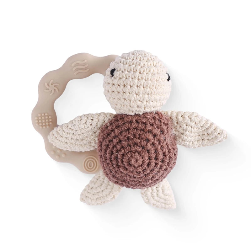 Rattle with different crocheted motifs